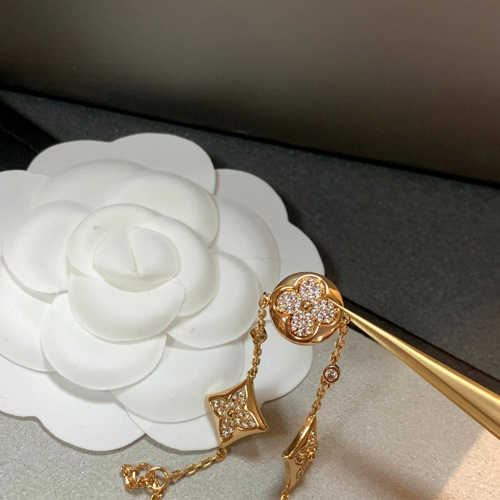 ¡®Imperial¡¯STAR AND SUN 4 MOTIFS GOLD DIAMONDS BRACELET